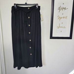 Plus size black midi skirt with button front and pockets